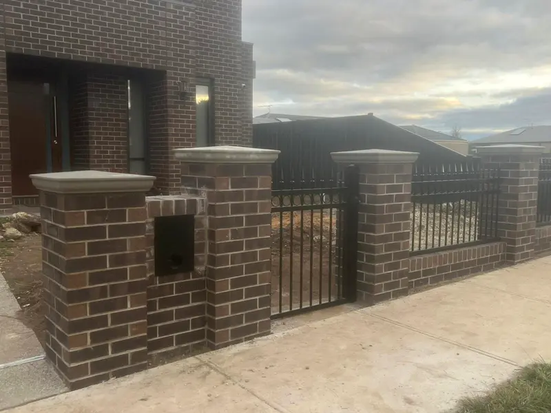 Brick fence piers with letterbox pier