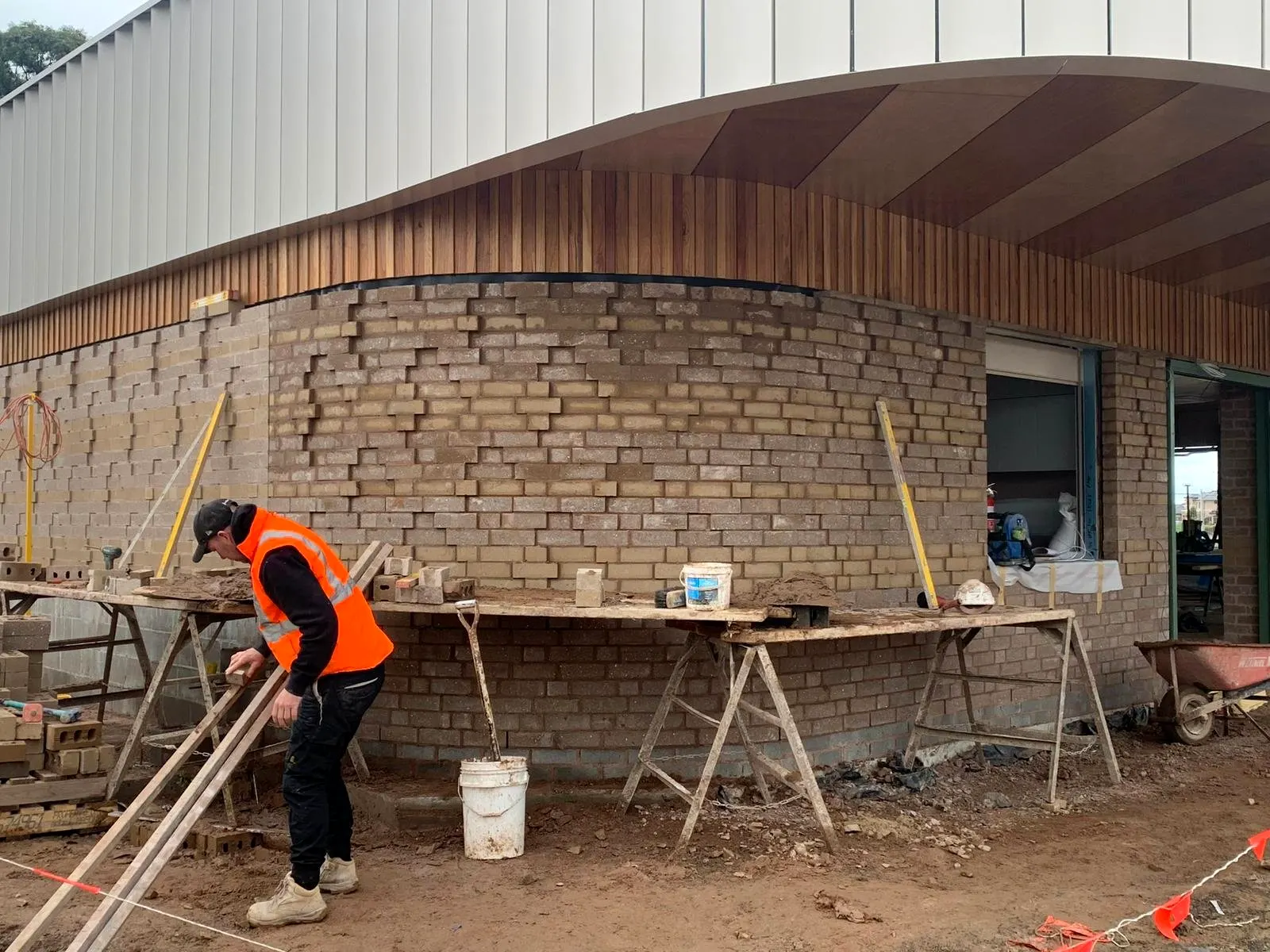 Curved feature brick wall being laid on site
