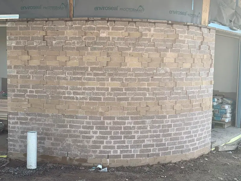 Curved blended brick feature wall