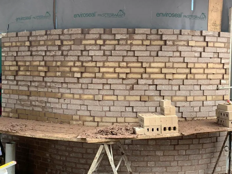 Close up of curved brickwork and fresh mortar joints