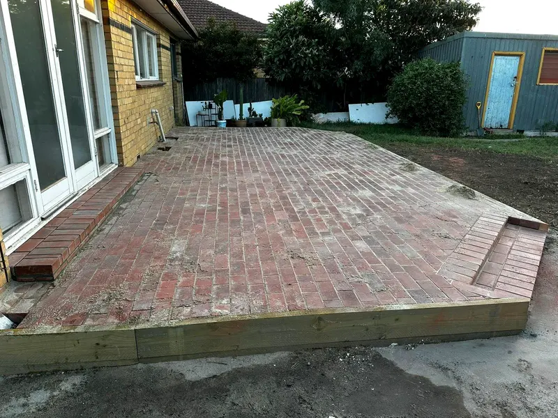 Red brick paved backyard patio